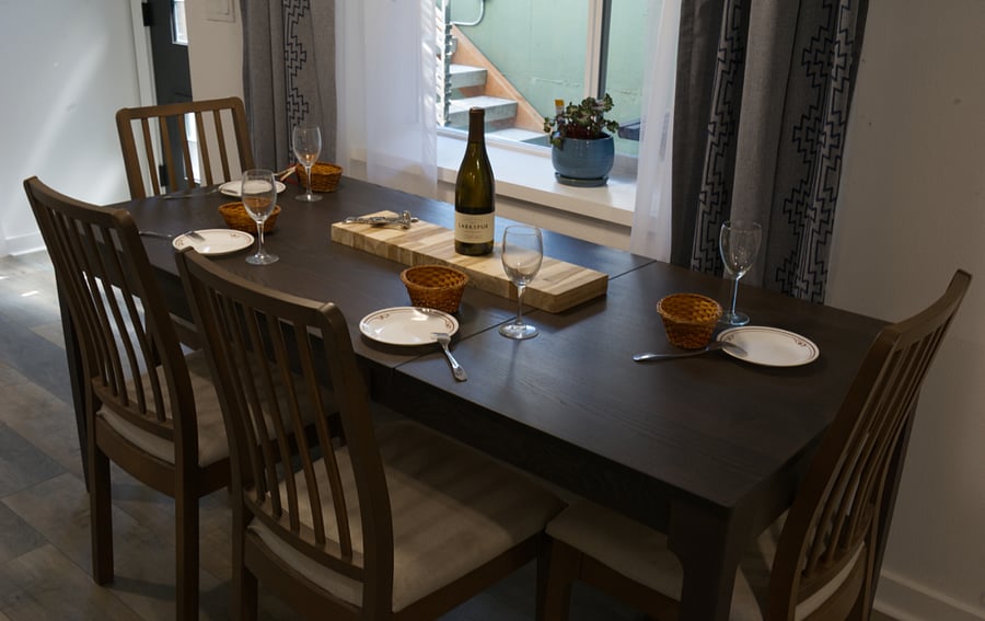 Dining table can be reduced to seat four or opened to seat six. Tables and seating on patio for outdoor dining as well.
