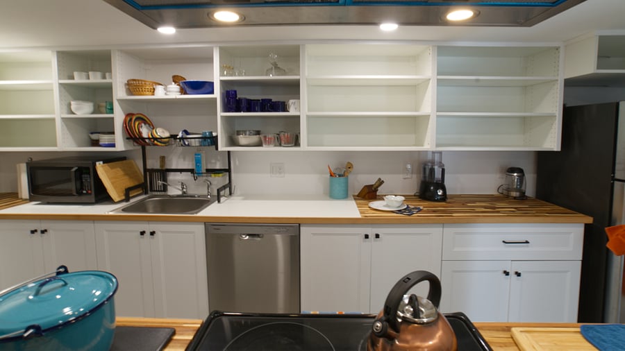 The kitchen has lots of supplies and small appliances. Fun drainboard over the sink lets water drip into sink.
New dishwasher.