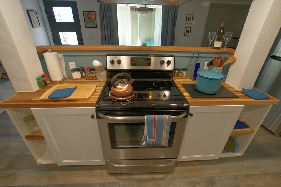 The kitchen island and serving shelf.