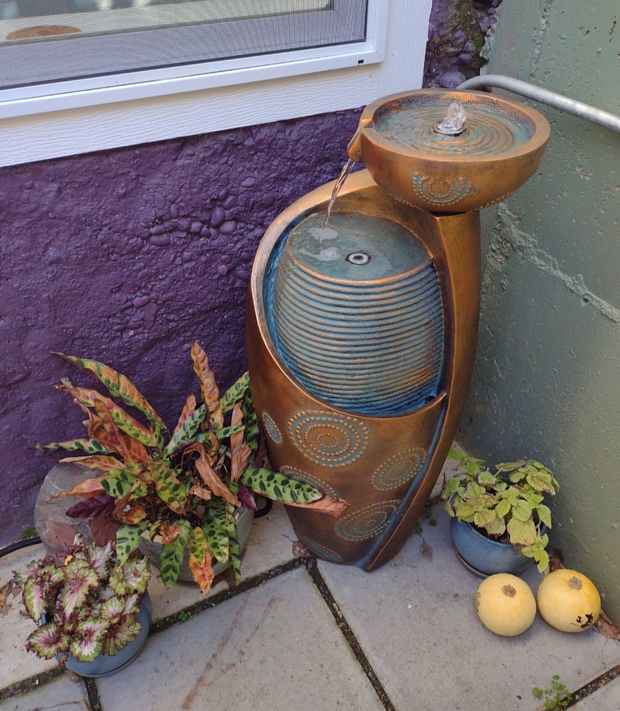 After the frost has passed, enjoy plants and a soft bubbling fountain in your private patio