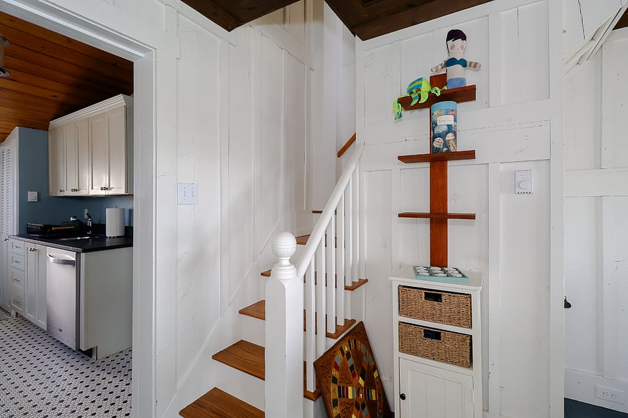 stairway to second story with bedrooms and 1/2 bathroom