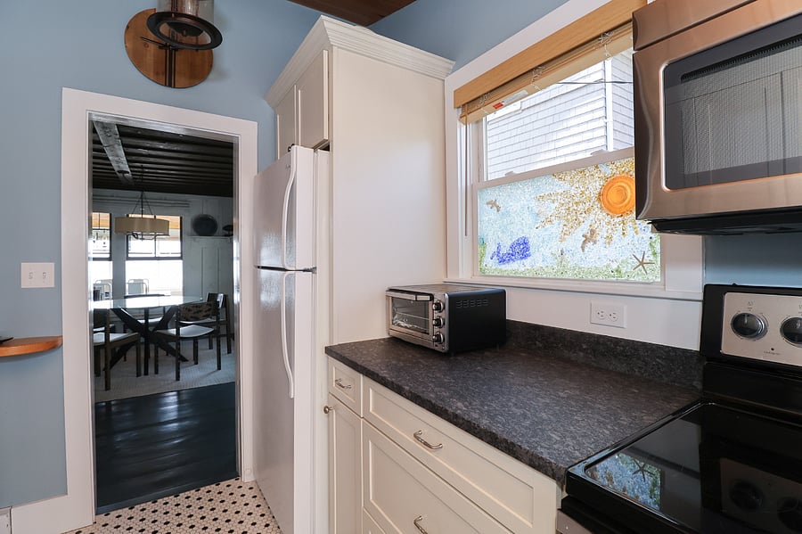 full-stocked kitchen with full-size fridge