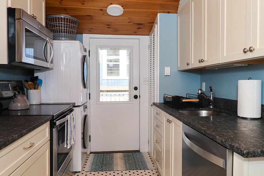 full-stocked kitchen with dishwasher