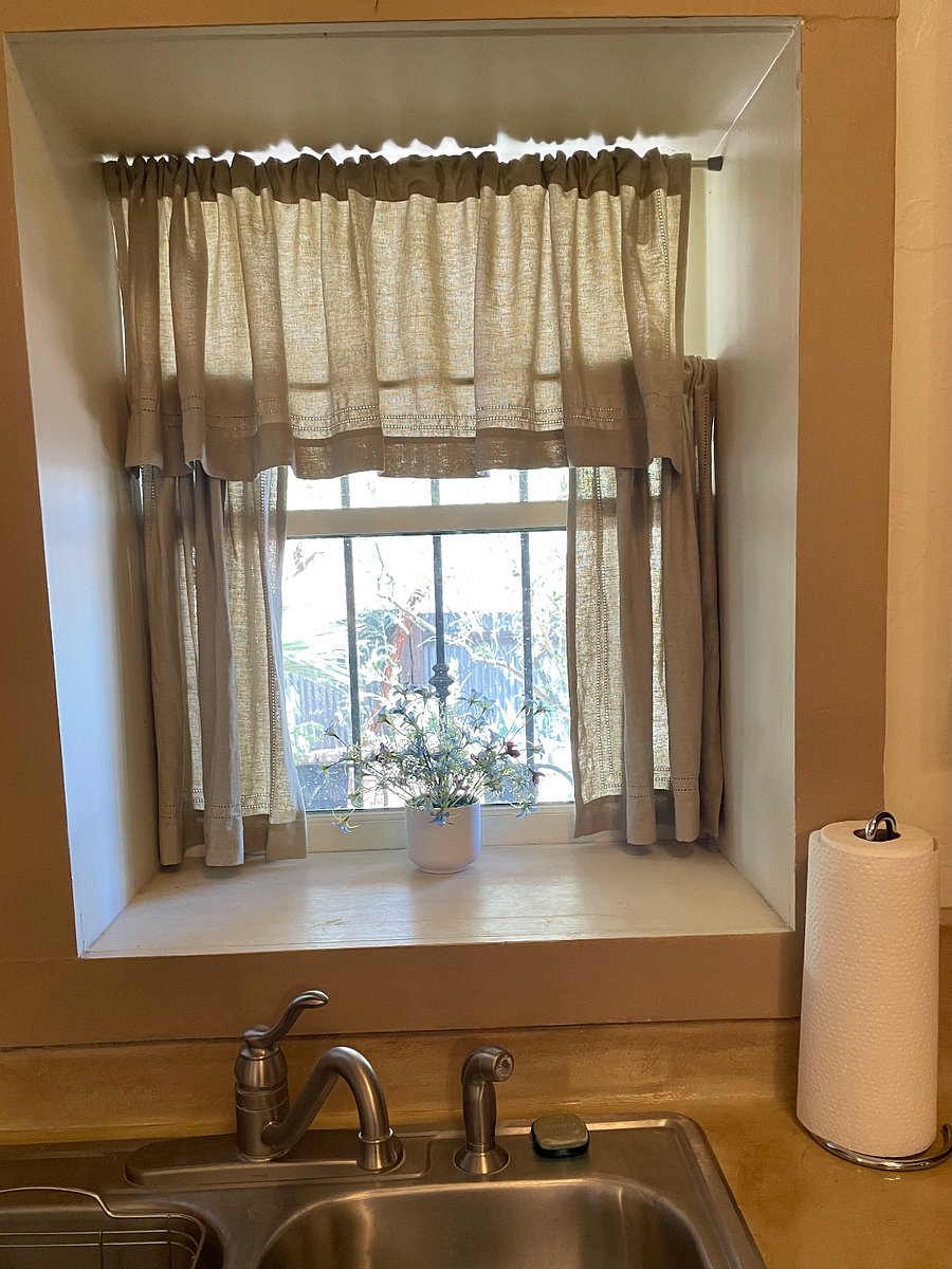 Window from kitchen to backyard. 
