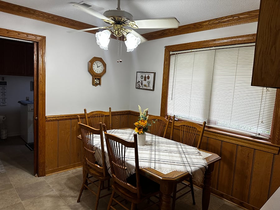 Breakfast area for small meals in the kitchen.  There is a 1/2 bath and washer/dryer to the left in this photo.