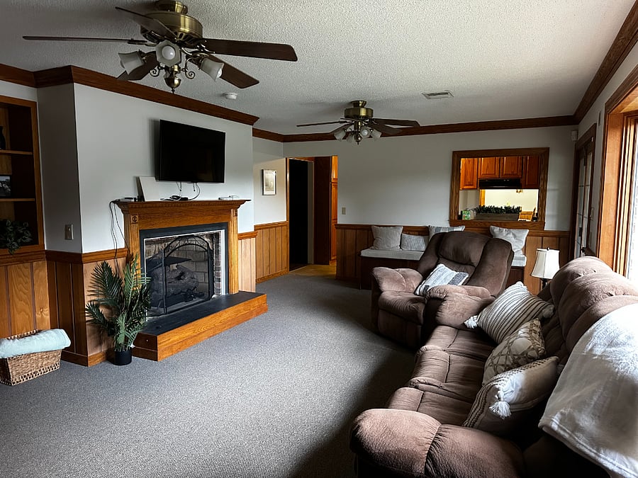 The cozy den on the backside of the house is the most popular area for relaxing after a long day.  There are gas logs and a smart TV in this room as well.  