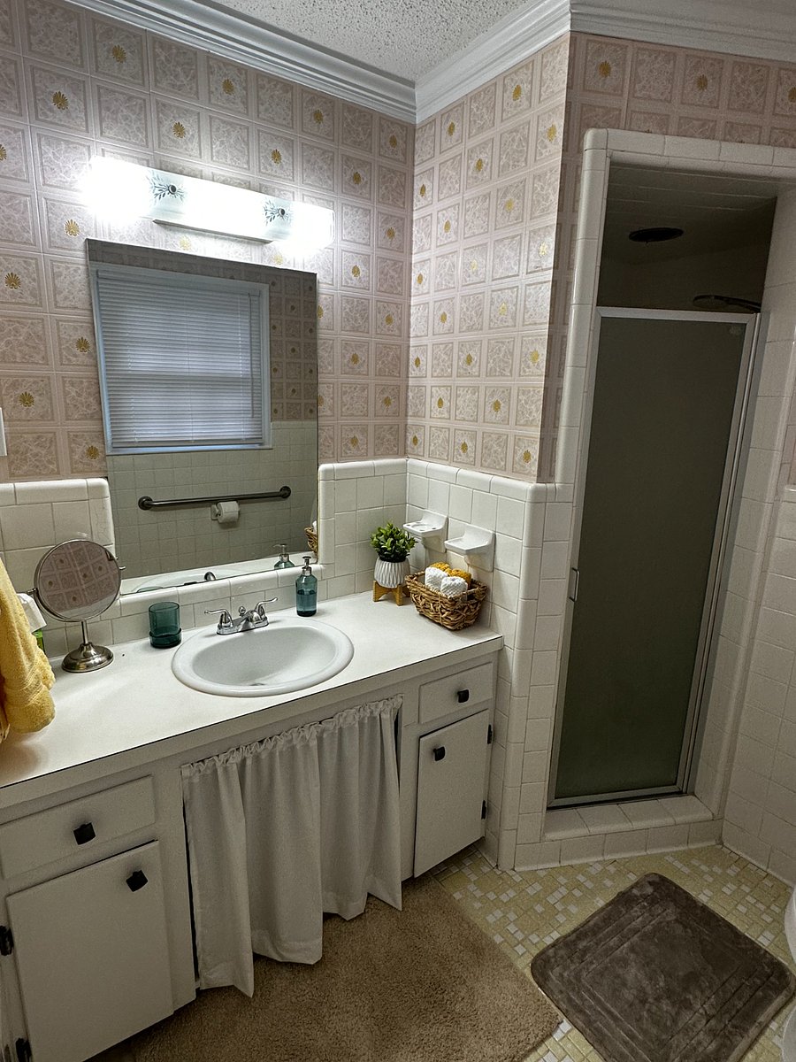 Master bathroom has a single vanity and walk in shower.  The sink is slightly lowered for wheelchair accessibility.  