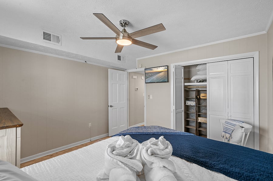 Queen bedroom with closet and smart TV
