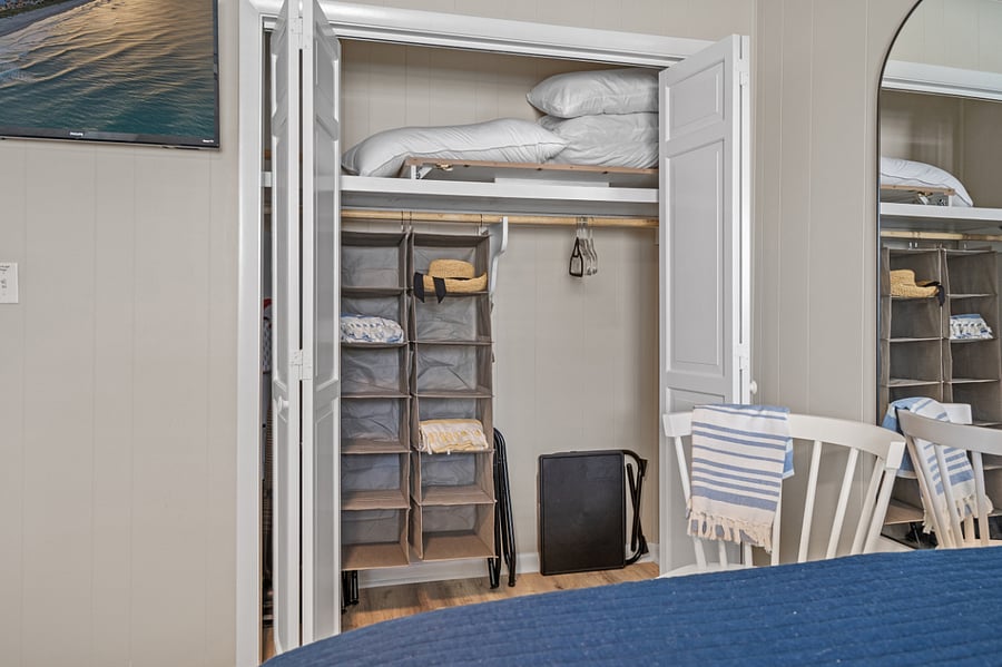 Queen bedroom closet and smart TV