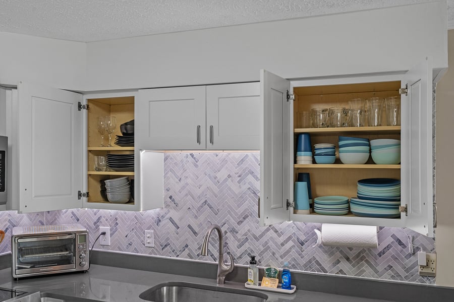 Fully stocked kitchen with under cabinet lighting