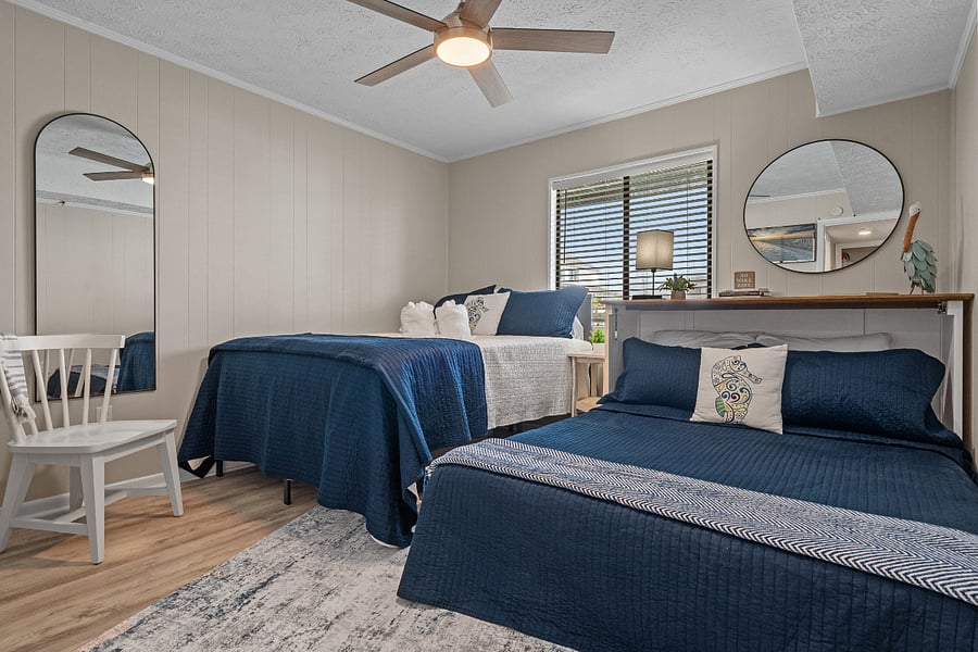 Queen bedroom with 1 queen bed and 1 queen-sized Murphy bed