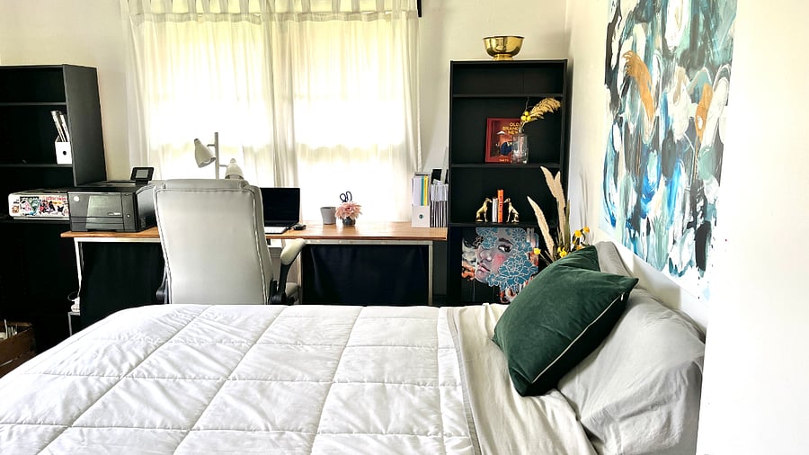 Artsy bedroom with a large desk