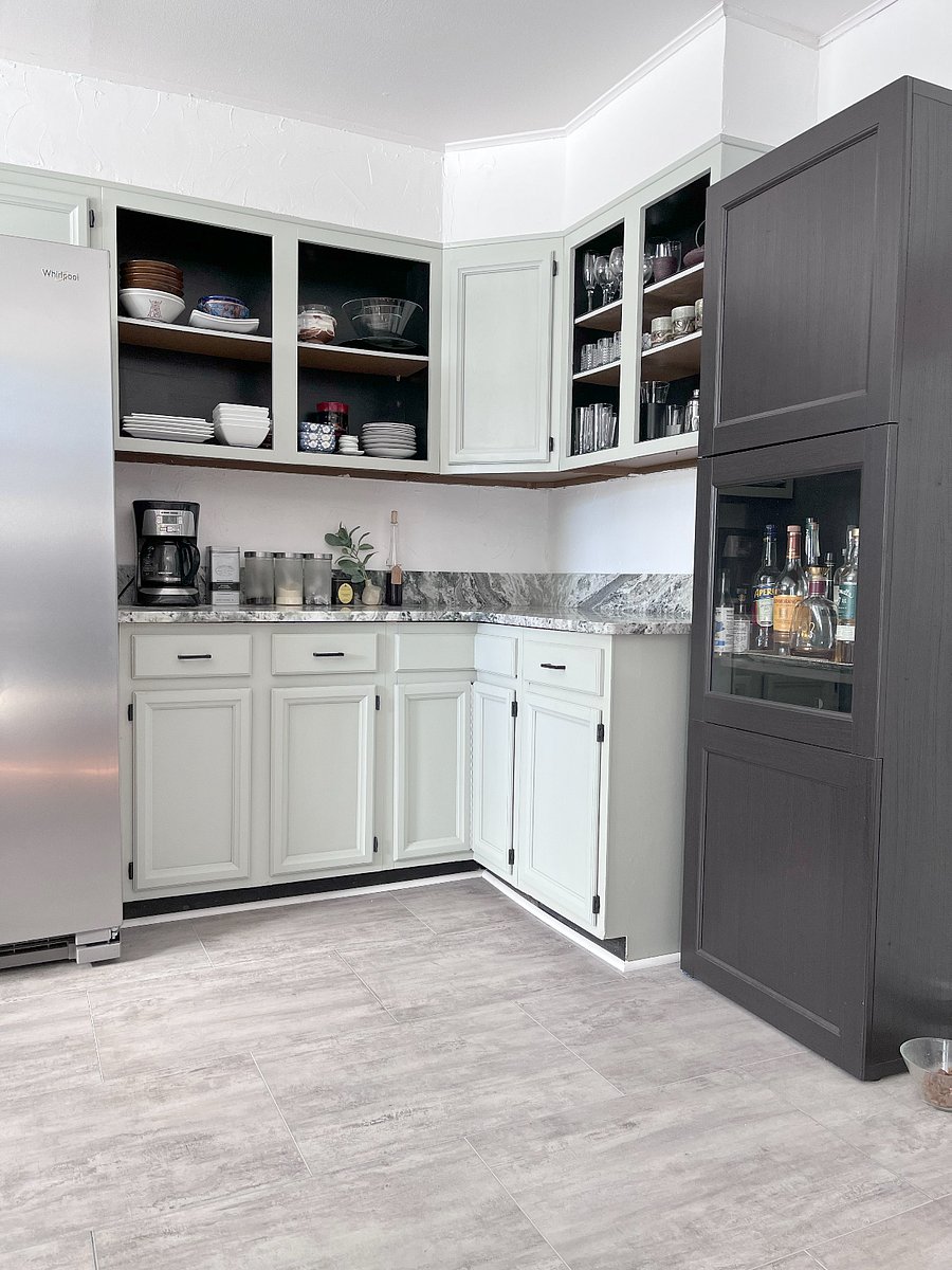Fully stocked kitchen with dishes, appliances, spices, condiments