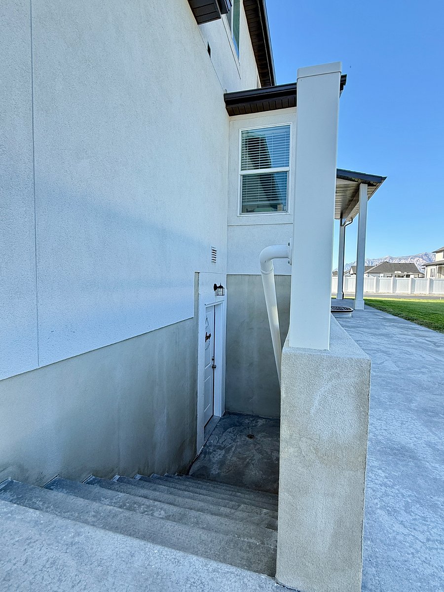 Outdoor stairwell leading to your exclusive basement entry door