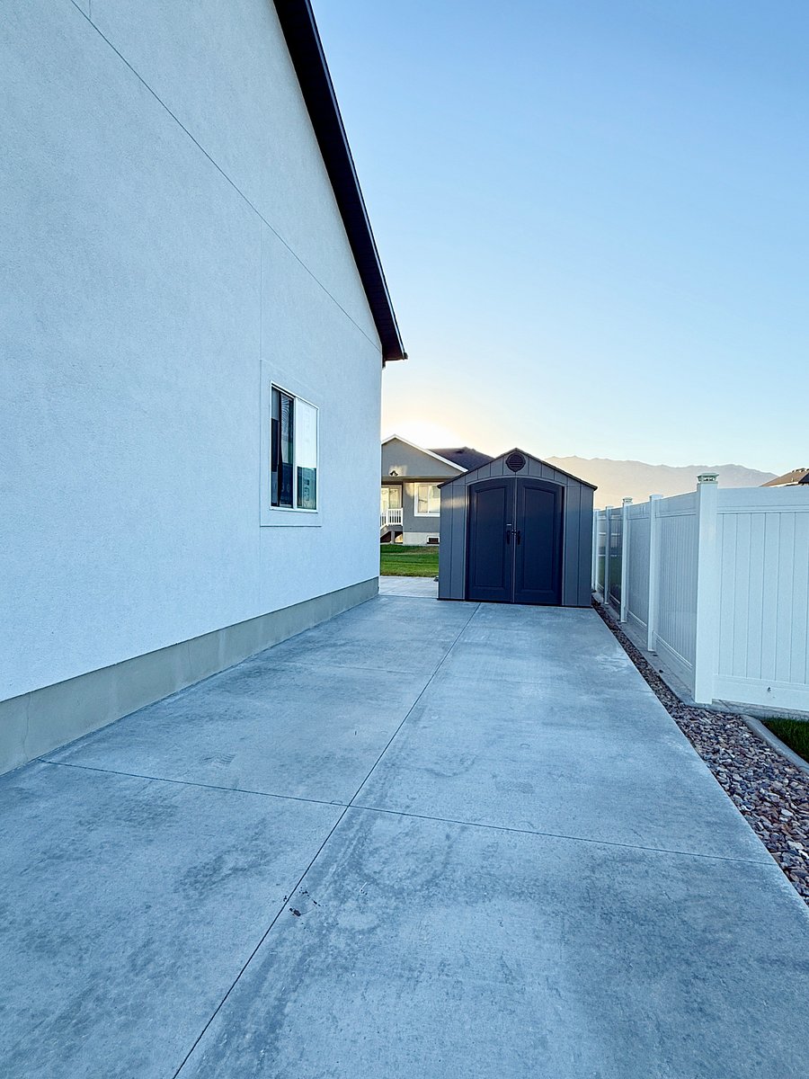 Spacious side driveway with two dedicated parking spots