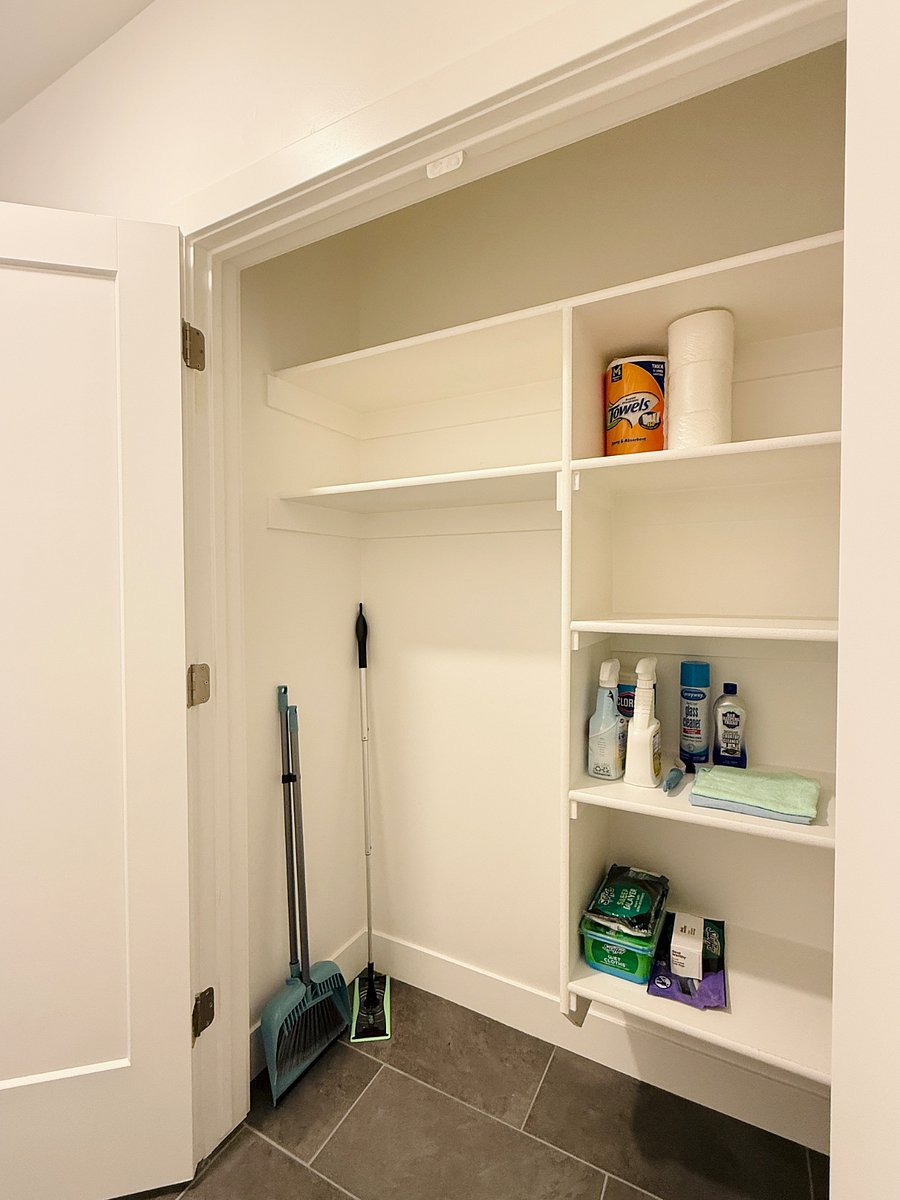 Additional view of the closet stocked with cleaning and paper supplies for your convenience