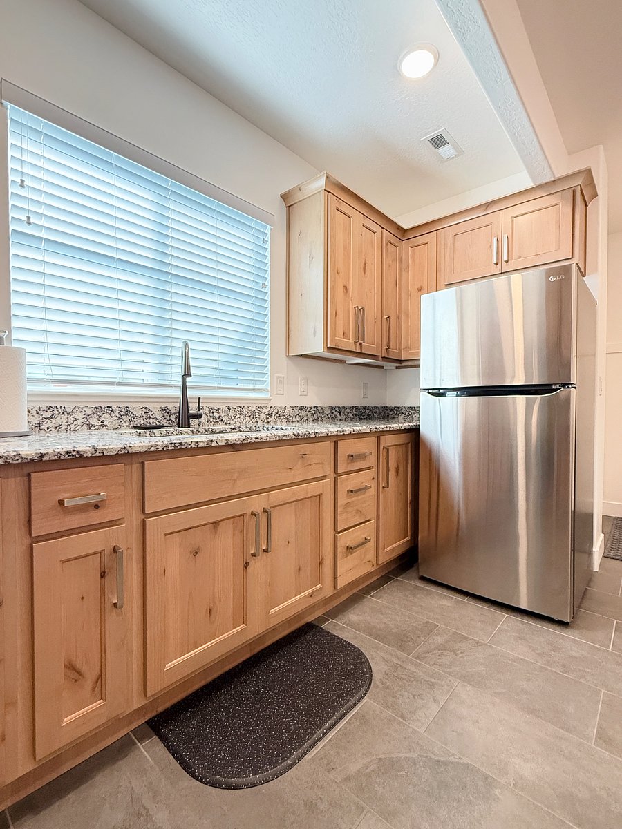 Generous cabinet space for all your food and pantry items, fully stocked with dishes and essentials for your stay