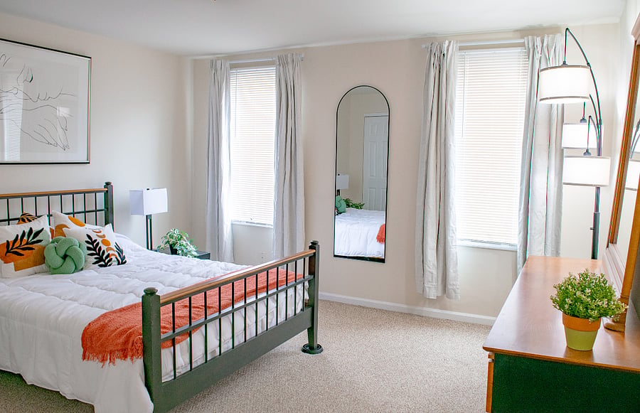 Large front bedroom with full length mirror, blackout curtains and ample closet space.