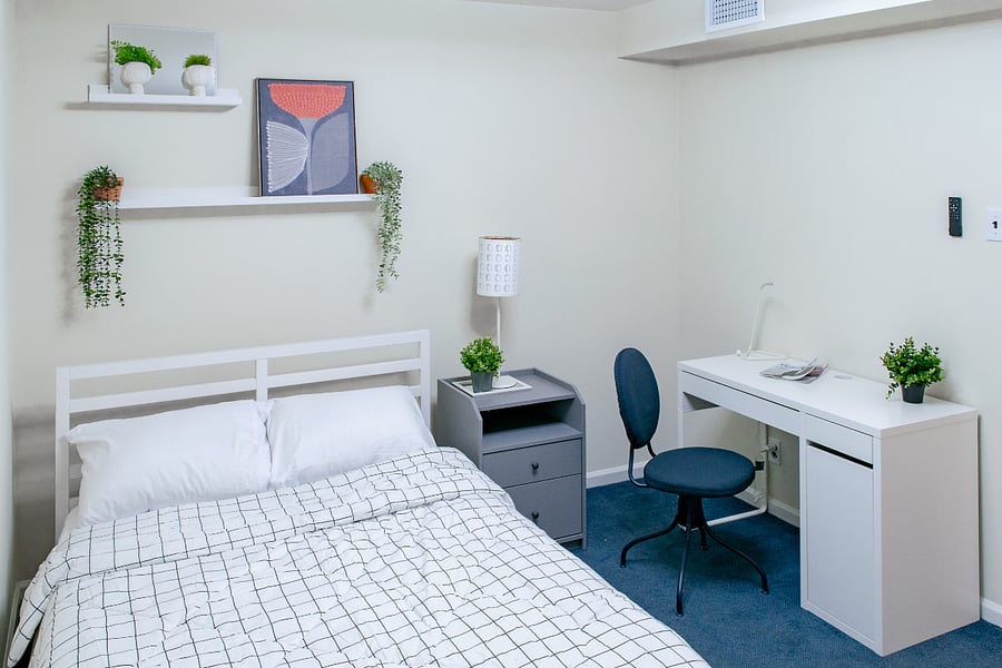 Middle room with full bed and work space