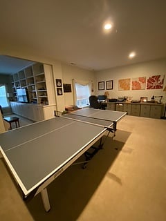 Large living area with desk and ping pong table. For your use only.