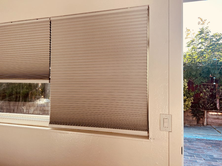 This blackout blind offers ultimate light control, transforming the sun-drenched room into a peaceful, dark sanctuary,  ensuring a deep and restful sleep at any time of day.