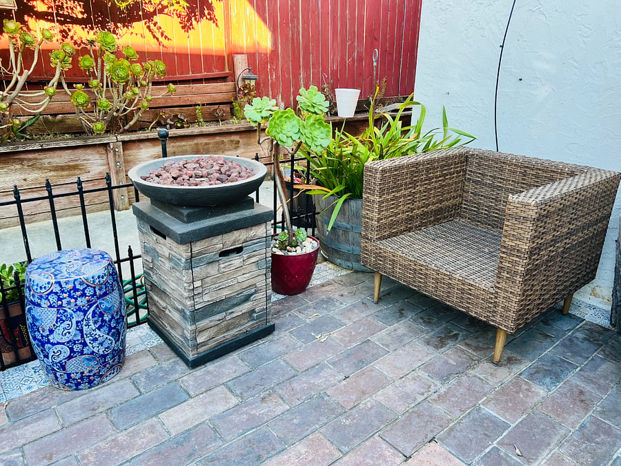 Our backyard includes a cozy fire pit, ready for you to enjoy. It's a great spot to sit and relax, providing warmth and a peaceful atmosphere for a quiet night in.