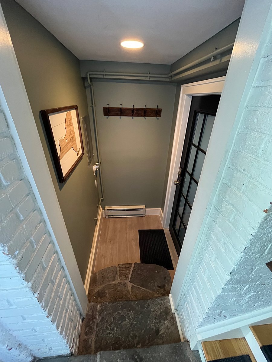 When you enter the house, the private entrance to the apartment is to your left.