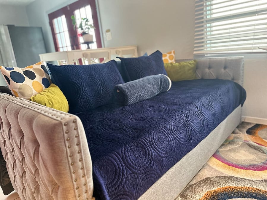 This living area features a daybed with trundle combo and sleeps two persons. Families can enjoy the Amazon TV while dinner is prepared in the open kitchen or dining areas