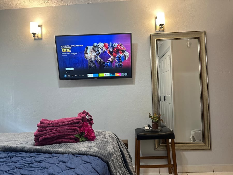 The suite has two large bedrooms, both with oversized mirrors when preparing for your day or night activities on island. The deluxe room offers Amazon TV, extra towels, seating, large closet with lighting, AC, blankets, fan