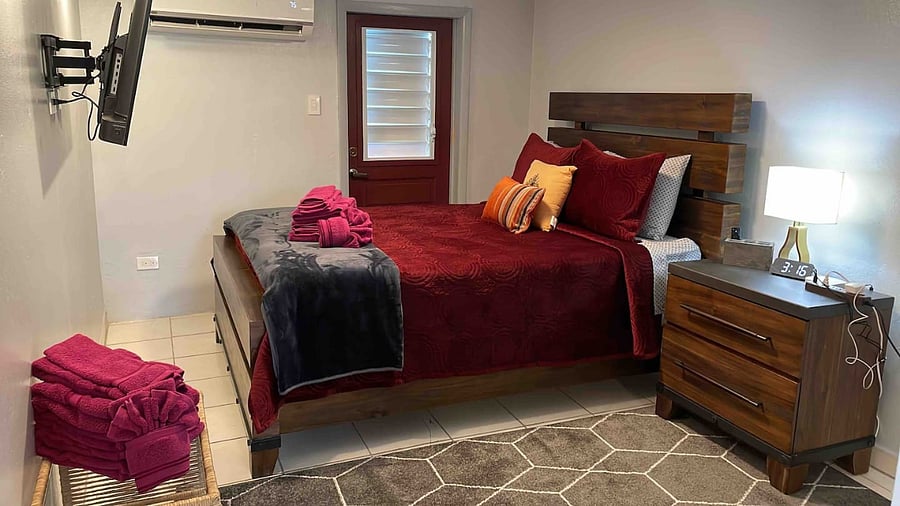 Queen bed in master bedroom with FireTV, extra storage, and cool AC sleeps 3 guests. Please let us know if your group requires our rollaway bed and we can set it up prior to arrival as this area is spacious.