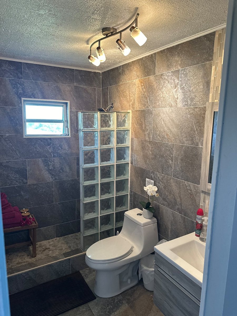 Step into zen in your suite with frosted glass wall, calming color palette, toiletries to pamper your group, dramatic lighting, mirror, and eco friendly duo flush latrine options