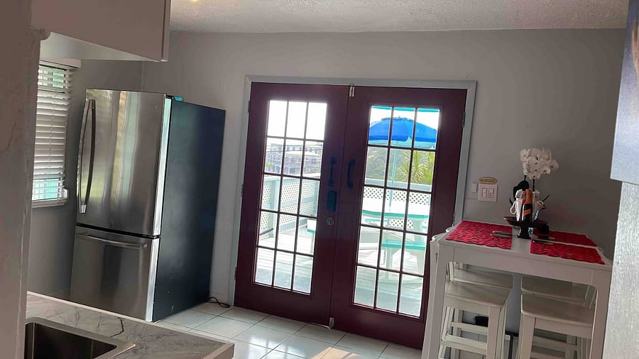 Dining area for your group to enjoy conversations, open concept dining and kitchen area for guests, outdoor dining on charming deck, and the best ocean views on the south shore