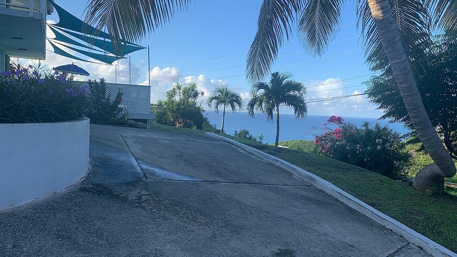 Entrance way with roundabout for taxi accessibility and guest parking, send us a message to ask about SUV rentals. There are no stairs to guest entrance from parking lot