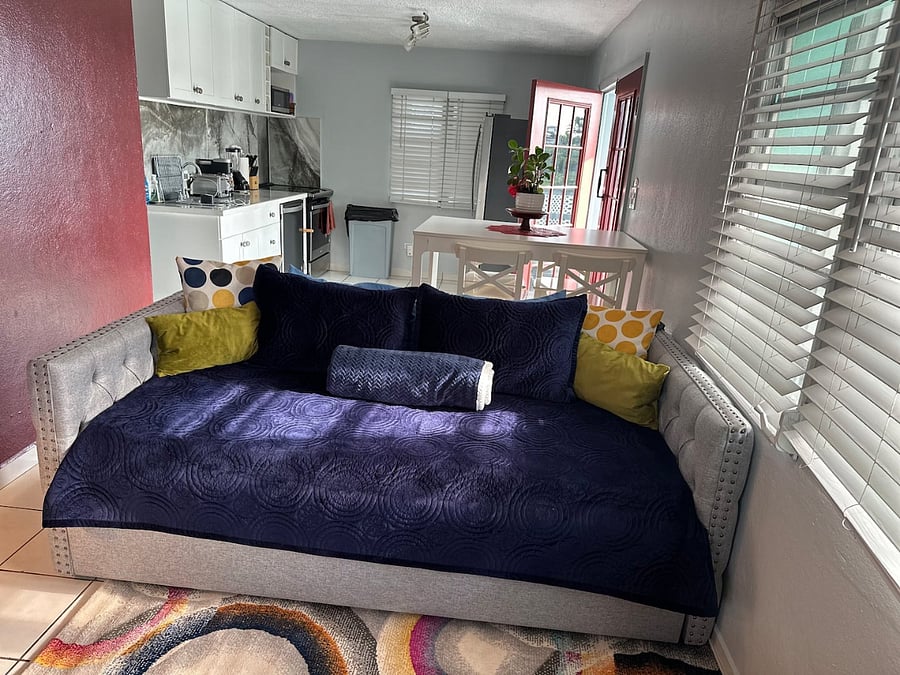 Multiple entertainment areas flowing from kitchen to dining and living in a large open space