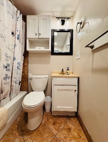 Shared bathroom - includes lil cabinet space for your toiletrees
