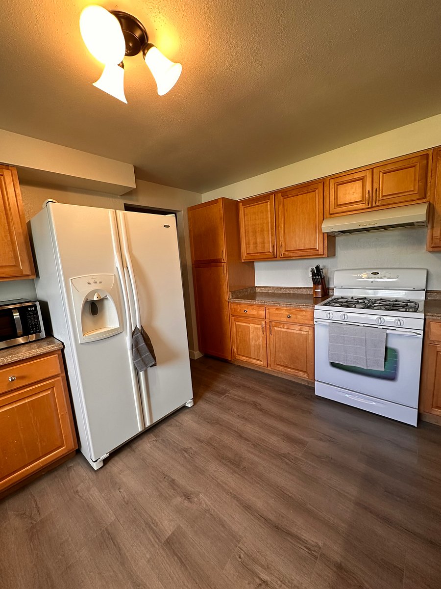 The kitchen has cooking supplies and plenty of storage. 