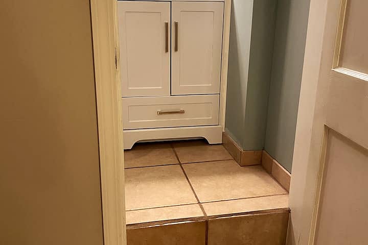 There is a single 11 inch (27 centimeter) step at the entrance to the bathroom. Other than that single step the entire rest of the apartment is flat and has no other steps.