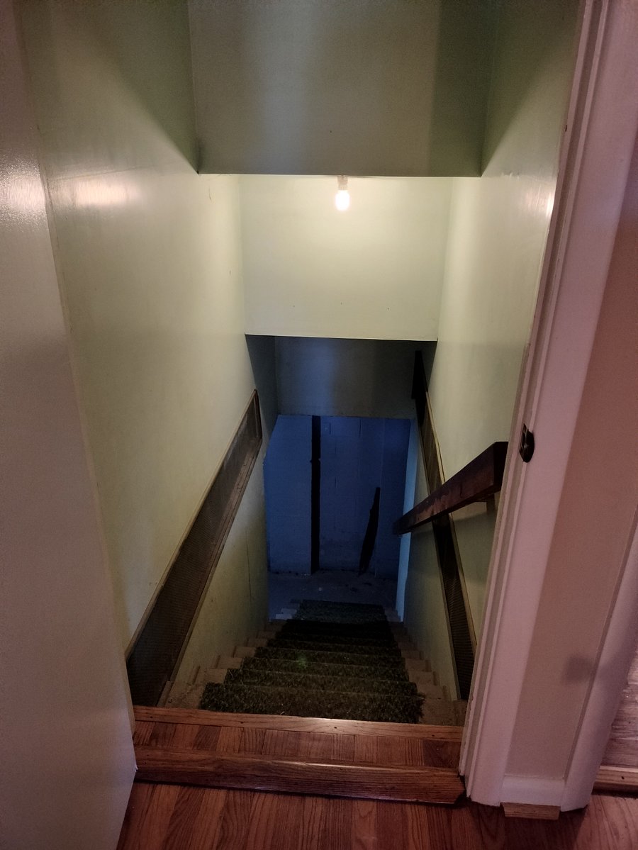 stairway to basement (storage, laundry, mechanical eqmt)