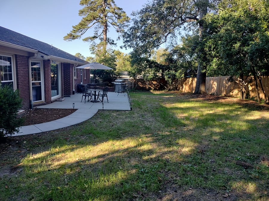 Backyard with large patio--Grill, firepit, dining table, bench and chair (firepit and shed not shown)