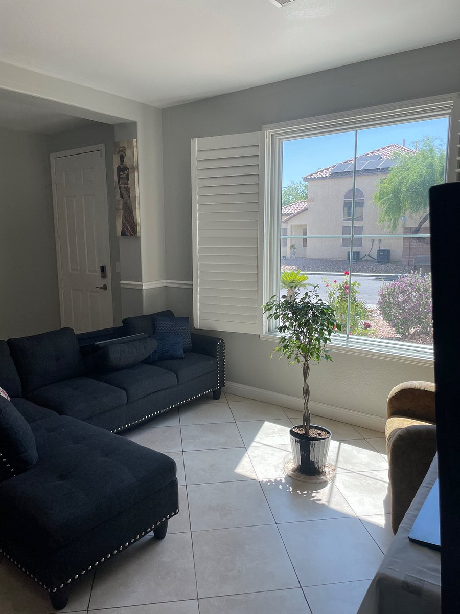View of living room with picture window & people cannot see inside, but can we can see outside. Only at night when the lights are on you could see inside. We have large shutter blinds for the windows.