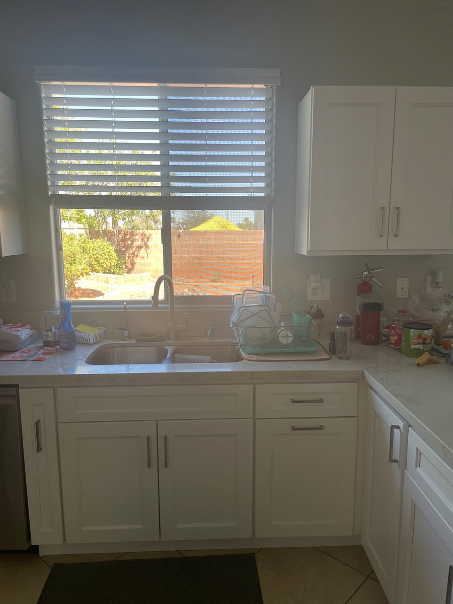 Another view of the kitchen in the backyard over the sink. We have a dishwasher just make sure to rinse food off items. Theres a trashcan right on the side of the sink on the right.  just