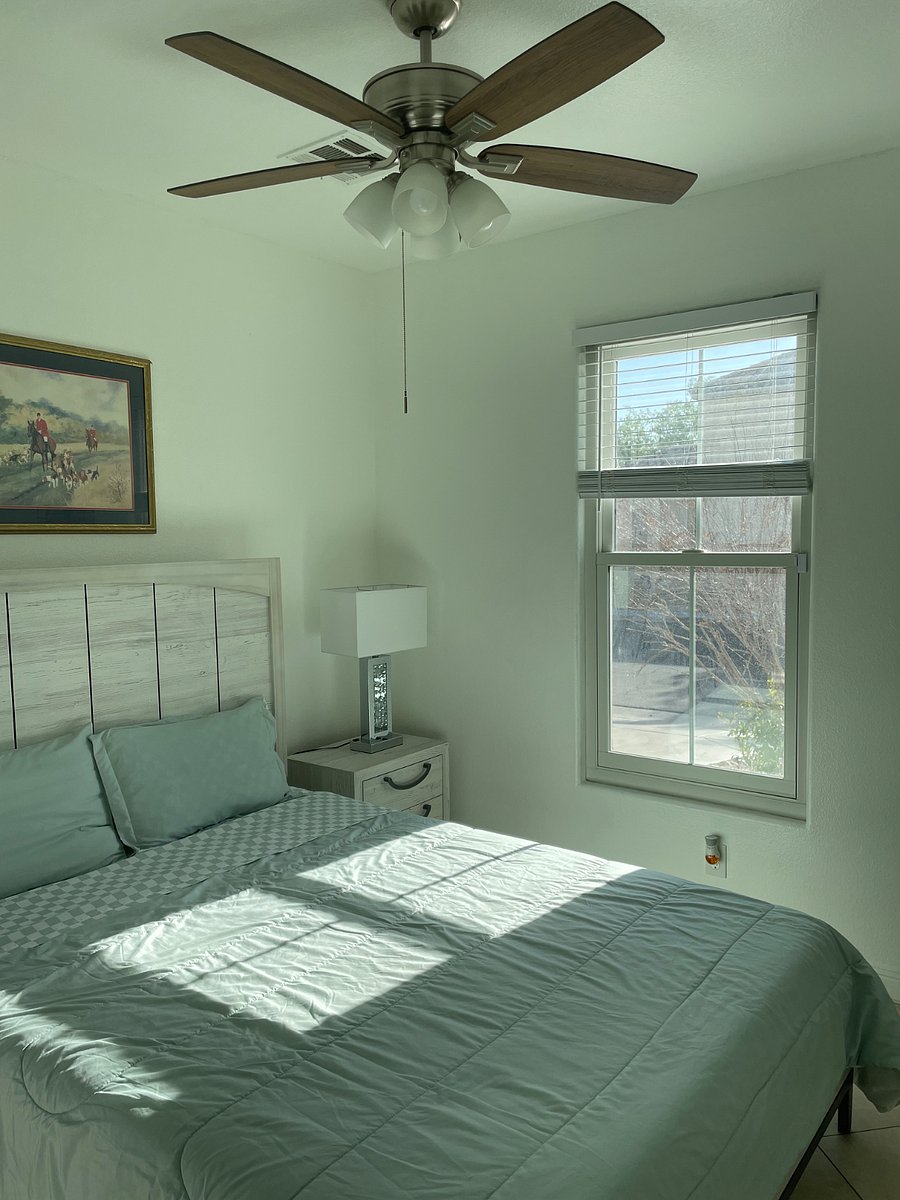 Bedroom number five downstairs view the front yard mountains view