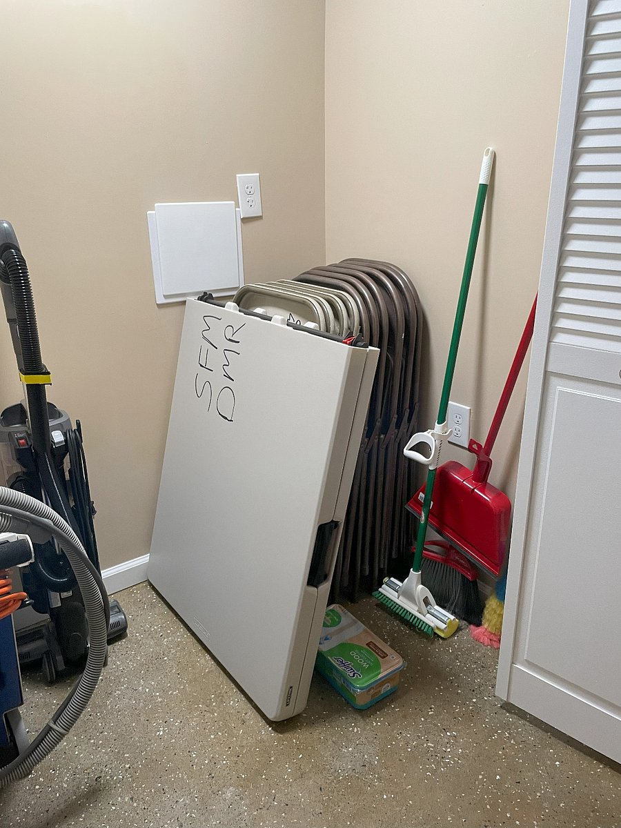 Supply Closet with indoor/outdoor 6-foot folding table and 10 folding chairs.