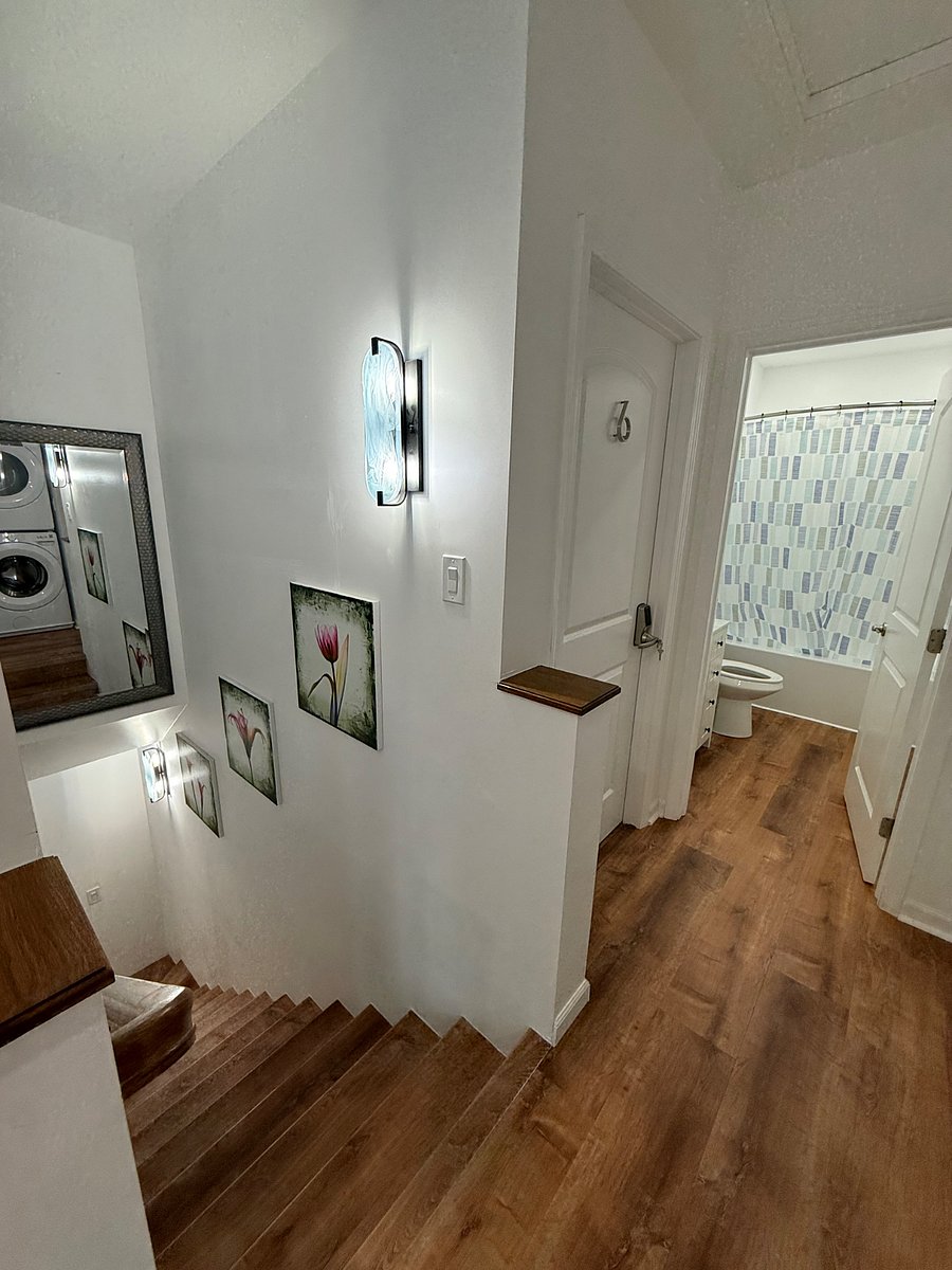 Shared space: Second floor bathroom and stairs going down to first floor.