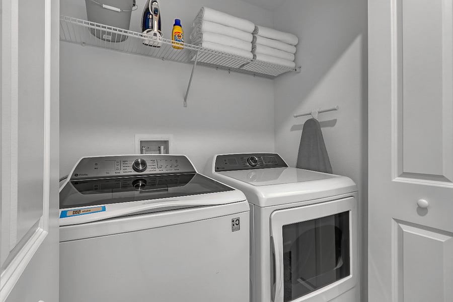 Upstairs laundry with washer, dryer, iron & board. 