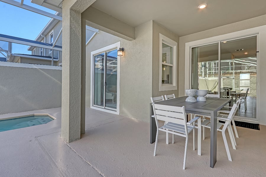 Outdoor dining with a relaxing pool view. 
