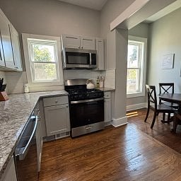Kitchen and dining area featuring stainless steel appliances.