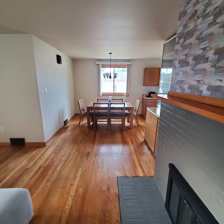 Another view of the dining room and newly refurbished hard wood floors.
