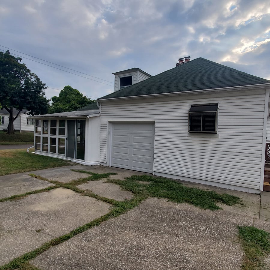 1 attached garage next to the large enclosed porch which provides more space when you just want to see what is going on outdoors in the neighborhood.