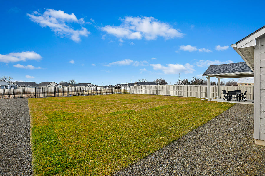 Fully fenced yard with views to the creek and walking path behind home.